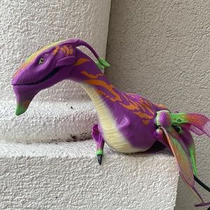 Disney Dragon that sits on your shoulder that you can control.